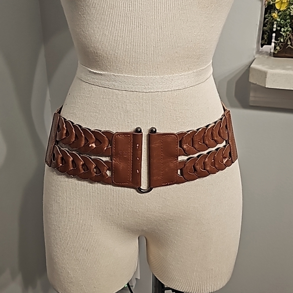 Stretch wide belt. There is some wear but picked it‎ up because it is cut…